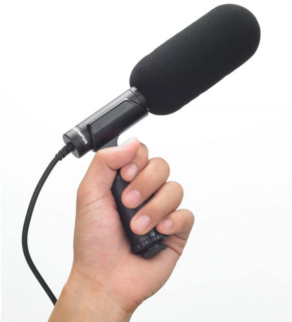 Photo of a person holding the Olympus ME-31 compact gun microphone | featured image for Olympus ME-31 Compact Gun Microphone.