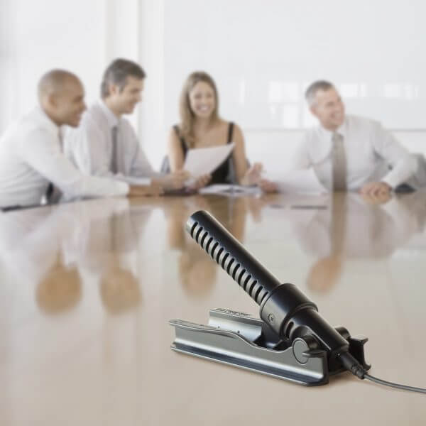 Photo of the Olympus ME-34 compact zoom microphone being used in a conference meeting | featured image for Olympus ME-34 Compact Zoom Microphone.
