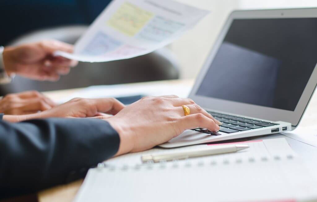 A pair of hands resting on an electronic typing keyboard | Featured image for Stenography Service - Court Reporter Service Page