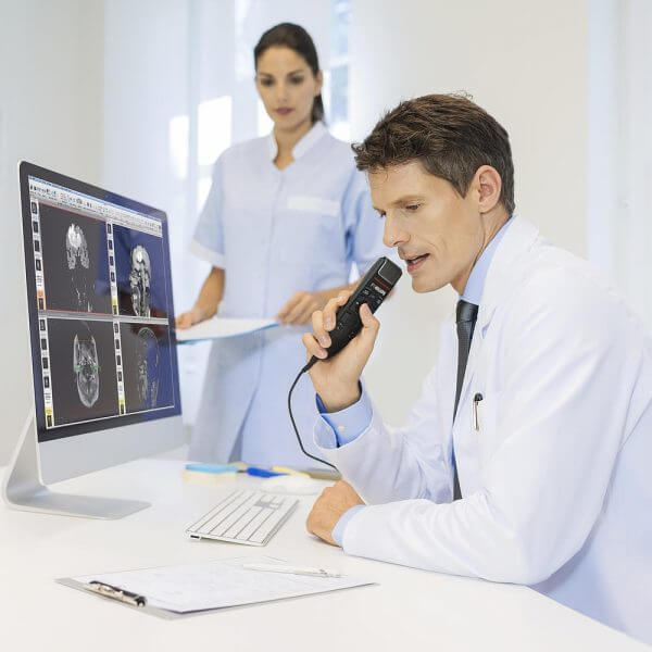Photo of a male doctor recording dictation | featured image for Philips SpeechMike Premium Touch SMP3710 Slider.