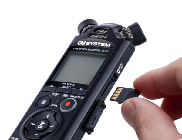 Photo of a dictation and transcription device with an SD card being put into it | Featured Image for Olympus Premium Dictation and Transcription Bundle Product Page by Pacific Transcription.