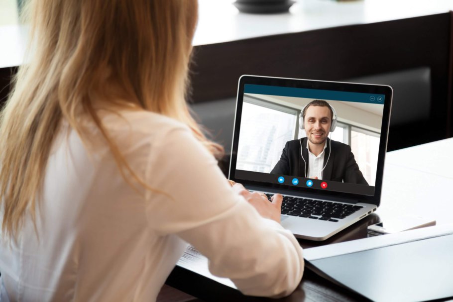 Business woman making video call to business partner via application | featured image for Recording Skype, Zoom, and Other Online Calls.
